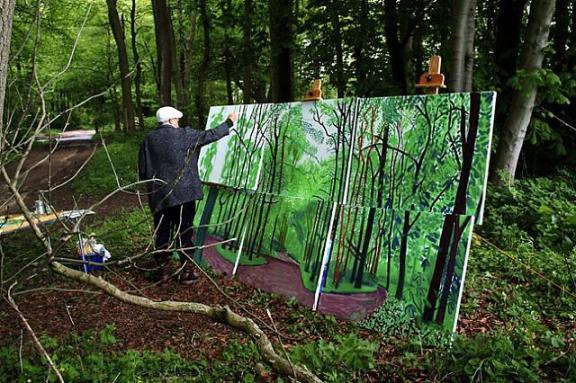 David Hockney while working on his canvas